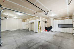Garage featuring a garage door opener