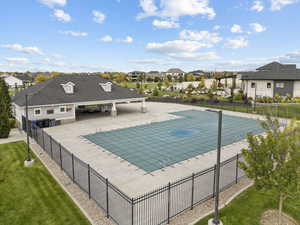 Community pool featuring a residential view and a patio area