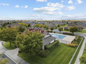 Aerial perspective of suburban area featuring a pool area