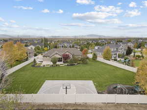 Aerial perspective of suburban area with a mountainous background
