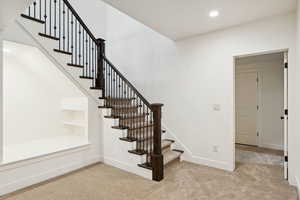 Stairway featuring carpet floors and recessed lighting