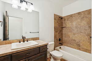 Bathroom featuring shower / bathtub combination and vanity