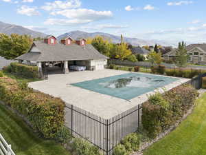 View of pool with a patio and a mountain view