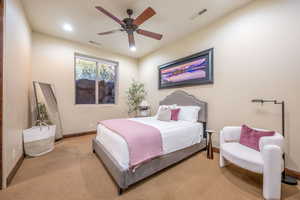 Bedroom with carpet floors, ceiling fan, and recessed lighting