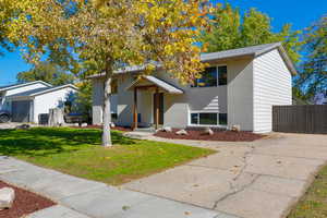 View of front facade featuring brick siding and a front lawn