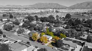 Aerial perspective of suburban area with a mountainous background