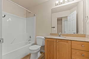 Full bathroom with vanity, light wood-style floors, and bathtub / shower combination