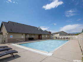 Community pool featuring a patio