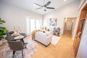 Living room featuring recessed lighting, french doors, light tile patterned floors, a ceiling fan, and high vaulted ceiling