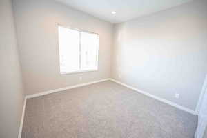 Unfurnished room featuring carpet floors and recessed lighting