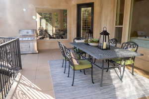 View of patio / terrace with outdoor dining area and exterior kitchen