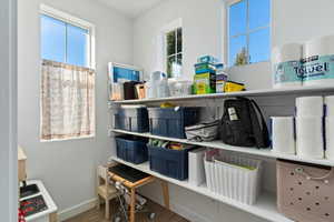 Additional large main-level storage room with built-in shelving (4.7 x 8.4), - rare in this area!