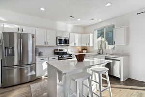 Quartz countertops, SS appliances, gas range, single-basin sink, & large pantry
