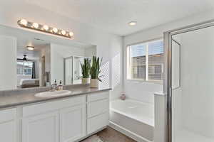 Spacious primary suite. 2 walk-in closets, separate tub & shower w/ cultured marble surround