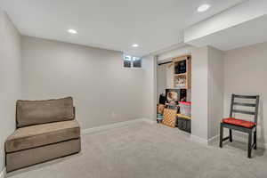 Living area featuring carpet flooring and recessed lighting