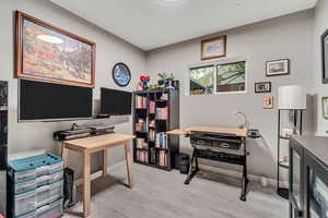 Office featuring light wood-style floors and baseboards