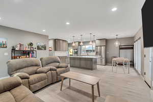 Living area featuring recessed lighting and light wood-style floors