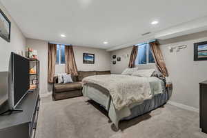Bedroom with carpet floors and recessed lighting