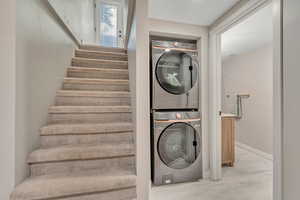 Laundry area with stacked washer / dryer