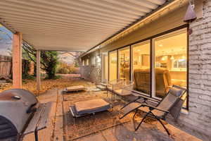 View of patio featuring a grill