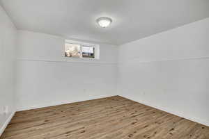 Spare room with wood finished floors and baseboards