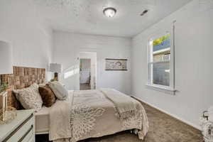 Bedroom with carpet and wooden walls