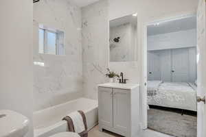 Full bathroom with bathtub / shower combination and vanity