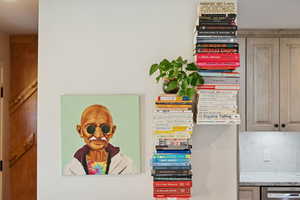 Detailed view of decorative backsplash and stainless steel dishwasher