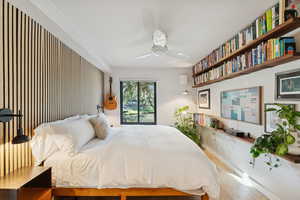 Bedroom featuring wood finished floors and a ceiling fan