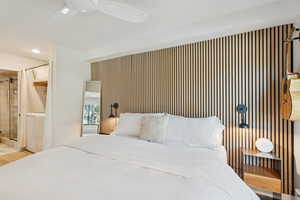 Bedroom with ceiling fan, ensuite bathroom, and recessed lighting