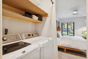 Washroom featuring a ceiling fan and washer and dryer