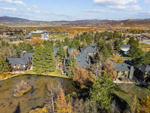 Aerial view of residential area featuring a water and mountain view