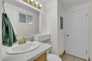 Bathroom featuring vanity and light tile patterned floors