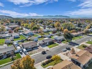 Aerial perspective of suburban area featuring a mountainous background