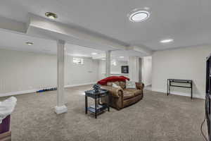 Living room with carpet flooring and baseboards