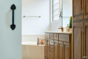 Bathroom with vanity and a garden tub