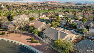 Aerial perspective of suburban area featuring a mountainous background