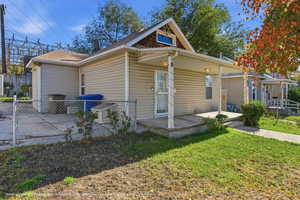 Bungalow-style home featuring a porch and roof with shingles