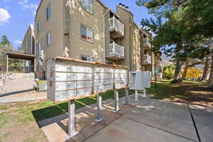 View of home's community with mail area