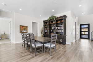 Dining room featuring recessed lighting and light wood-type flooring