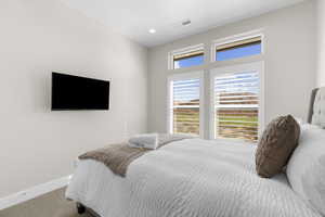 Bedroom featuring carpet floors and recessed lighting