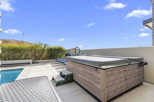 View of patio / terrace featuring a hot tub