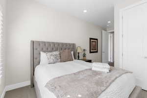 Bedroom with recessed lighting and carpet