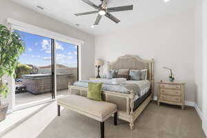 Carpeted bedroom featuring access to exterior, a ceiling fan, and recessed lighting