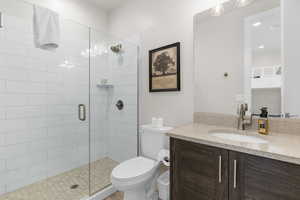 Bathroom with vanity and a stall shower