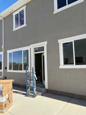Property entrance with stucco siding