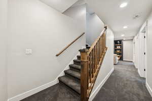 Staircase featuring carpet floors and recessed lighting