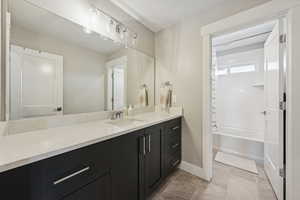 Full bath featuring vanity and shower / bath combination with curtain