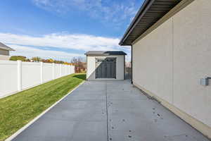 View of patio / terrace featuring a shed