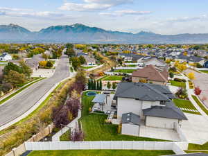 Aerial view of residential area featuring a mountainous background